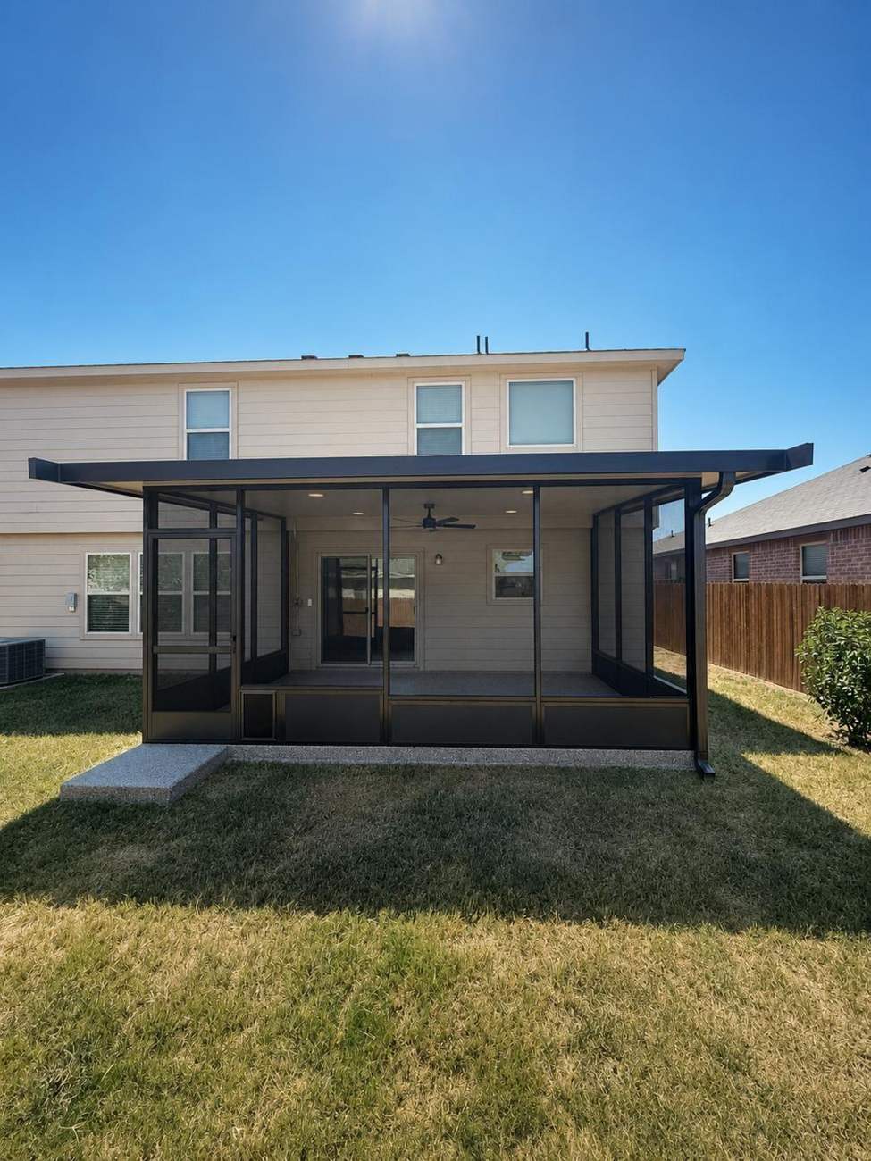 Cantilevered patio cover across the full back of a Fort Worth home