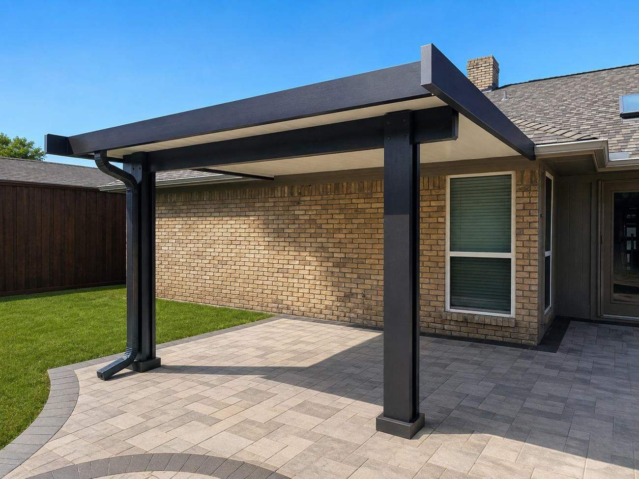 Black modern insulated cover on brick home