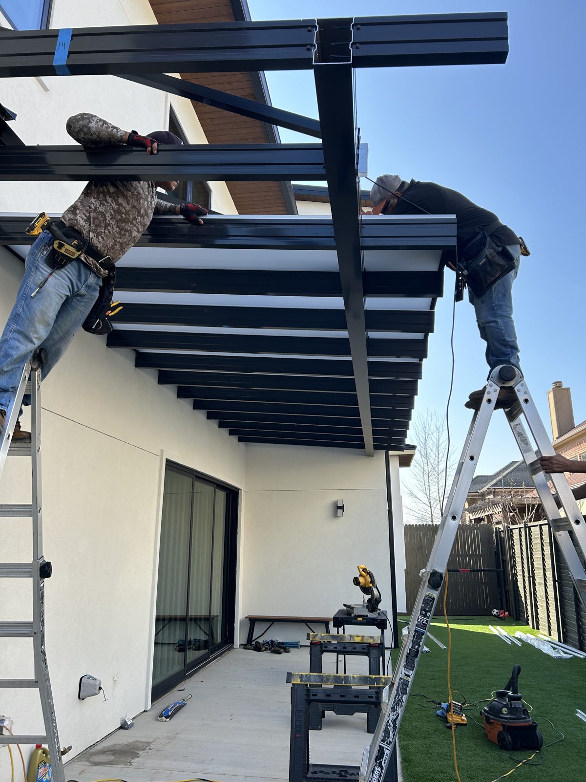 CertiPro crew installing an aluminum patio cover