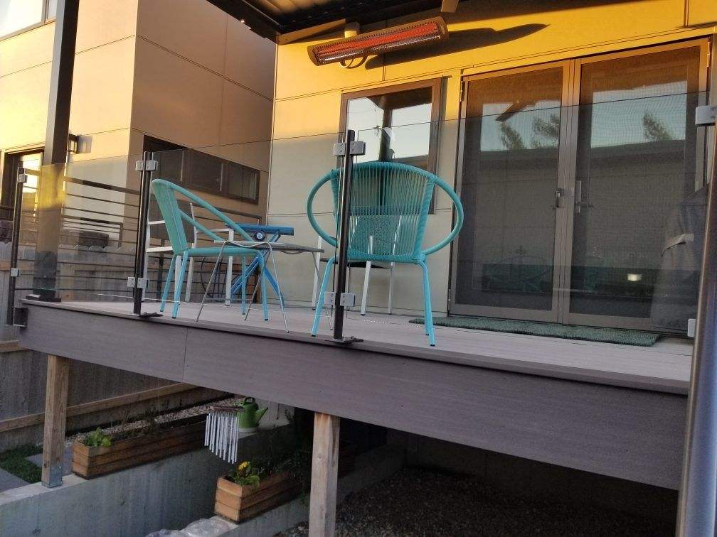 Covered composite deck with cable rail and steps
