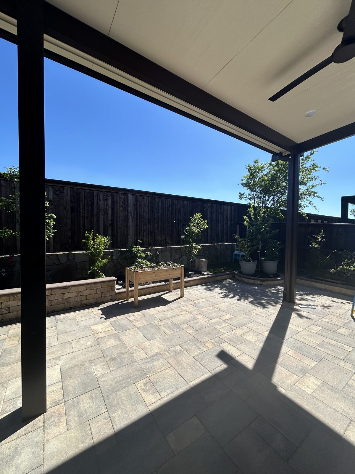 Modern insulated patio cover with ceiling fan