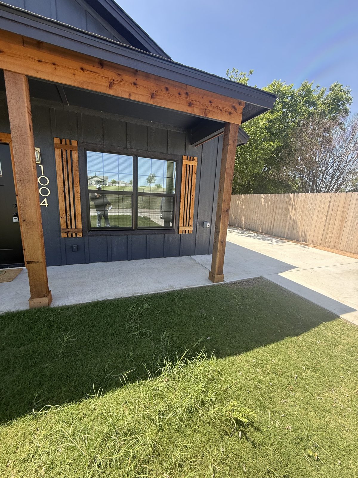 Modern cover with cedar posts and turf