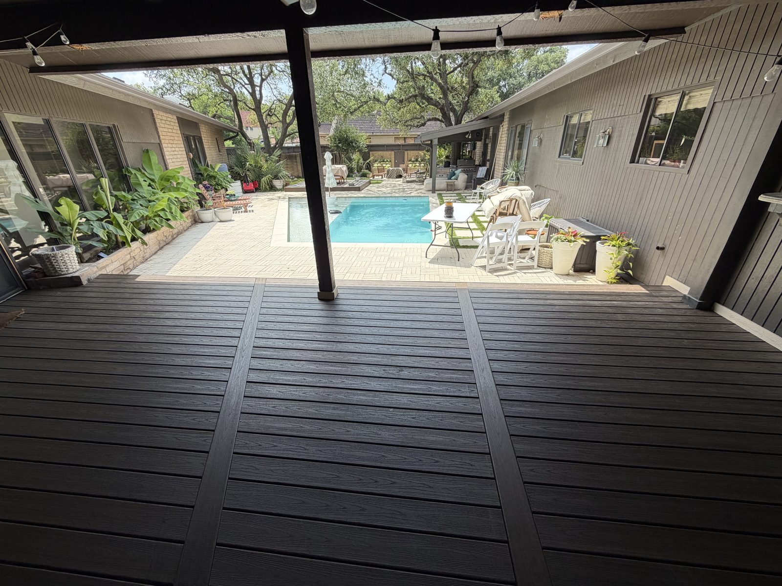 Poolside covered patio with composite deck