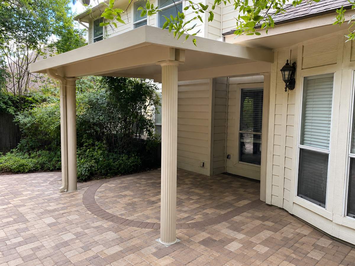 Tan insulated cover over a circle-pattern paver patio