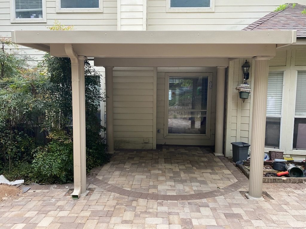 Solid cover at back door with pavers