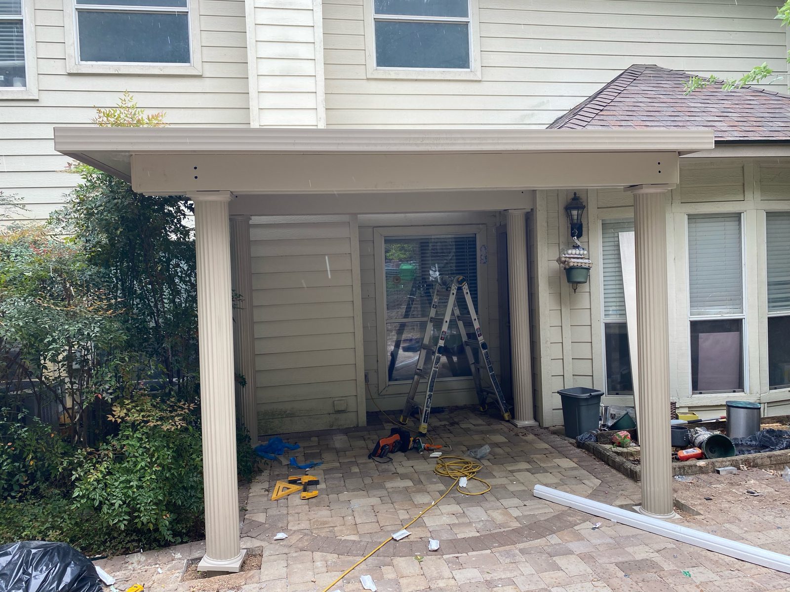 Tan Alumawood solid cover over paver patio