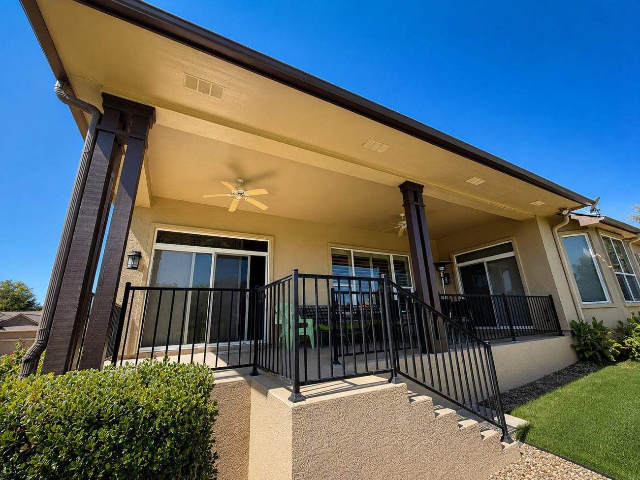 Tan patio cover with column posts